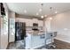Well-lit kitchen with stainless appliances, a kitchen island, and modern finishes at 13921 Scarlet Sage Ln, Parker, CO 80134