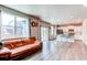 Bright, open-concept living room and kitchen with hardwood floors and modern finishes at 13921 Scarlet Sage Ln, Parker, CO 80134