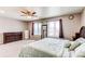 Large main bedroom with a ceiling fan, and a large mirror at 13921 Scarlet Sage Ln, Parker, CO 80134