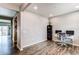 Office space with hardwood flooring, a large window, and an office setup at 13921 Scarlet Sage Ln, Parker, CO 80134