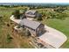 Beautiful front yard with a long driveway leading to the home and detached garage at 8682 N Sundown Trl, Parker, CO 80134