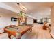 Recreational basement area featuring a pool table, bar, and cozy seating for entertainment at 8682 N Sundown Trl, Parker, CO 80134