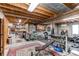 Unfinished basement gym area with workout equipment, storage, and an open layout for customization at 8682 N Sundown Trl, Parker, CO 80134
