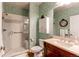Charming bathroom featuring a walk-in shower, and a patterned wallpaper at 8682 N Sundown Trl, Parker, CO 80134