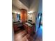 Bathroom boasting granite counters, dual mirrors, wood cabinets, and hard wood floors at 8682 N Sundown Trl, Parker, CO 80134