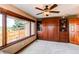 Comfortable bedroom featuring a large window, built-in cabinets, and ample natural light at 8682 N Sundown Trl, Parker, CO 80134