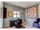 Bright bedroom featuring a sewing machine and views of the outdoors at 8682 N Sundown Trl, Parker, CO 80134