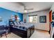Bright bedroom featuring a double bed, a ceiling fan and ample natural light from the window at 8682 N Sundown Trl, Parker, CO 80134