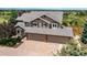 Beautiful home featuring a brick and siding exterior, complemented by a spacious three-car garage at 8682 N Sundown Trl, Parker, CO 80134