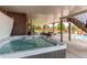 Relaxing hot tub on a concrete patio with ample seating and beautiful backyard views at 8682 N Sundown Trl, Parker, CO 80134