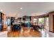 Open kitchen and dining area with dark wood cabinets, stainless steel appliances, and a large island at 8682 N Sundown Trl, Parker, CO 80134