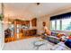 Open-concept living area with hardwood floors and a view of the kitchen and dining room at 8682 N Sundown Trl, Parker, CO 80134