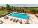 Inviting backyard pool with lounge chairs, barbecue, and outdoor seating, creating a perfect retreat at 8682 N Sundown Trl, Parker, CO 80134