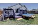 Backyard deck with stairs, railing and above ground pool at 4361 Kirk Ct, Denver, CO 80249