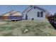Backyard showcasing a manicured lawn, deck, and above ground pool at 4361 Kirk Ct, Denver, CO 80249