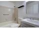 Bathroom featuring tiled shower, white fixtures, and an updated vanity at 4361 Kirk Ct, Denver, CO 80249