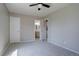 Bedroom features neutral walls, carpet, closet, and an ensuite bathroom at 4361 Kirk Ct, Denver, CO 80249