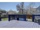 Backyard deck with blue trim and an above ground pool and nice green lawn at 4361 Kirk Ct, Denver, CO 80249