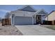 Charming single-Gathering home with a two-car garage, covered porch, and well-maintained landscaping at 4361 Kirk Ct, Denver, CO 80249