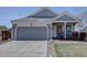 Charming single-Gathering home with a two-car garage, covered porch, and well-maintained landscaping at 4361 Kirk Ct, Denver, CO 80249