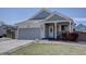 Charming single-Gathering home with a two-car garage, covered porch, and well-maintained landscaping at 4361 Kirk Ct, Denver, CO 80249