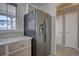 Close up of the refrigerator and cabinets in the kitchen of the house at 4361 Kirk Ct, Denver, CO 80249