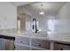 Bright kitchen with a large sink and stainless steel dishwasher, open to the living area at 4361 Kirk Ct, Denver, CO 80249