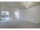 Spacious living room with vaulted ceilings, sliding glass door access to the backyard at 4361 Kirk Ct, Denver, CO 80249