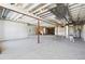 Large unfinished basement with exposed beams and support structures at 6653 Bridlespur St, Castle Pines, CO 80108