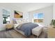 Sunlit bedroom featuring large windows, a comfortable bed, and stylish decor at 6653 Bridlespur St, Castle Pines, CO 80108