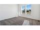 Bedroom features a carpeted floor, two windows, and white walls at 6653 Bridlespur St, Castle Pines, CO 80108