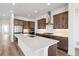 Spacious kitchen features an island with quartz countertops and stainless steel appliances at 6653 Bridlespur St, Castle Pines, CO 80108