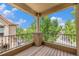 A cozy balcony offers views of lush green trees and blue skies, perfect for relaxation and outdoor enjoyment at 10127 Bluffmont Ln, Lone Tree, CO 80124