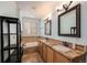 Bright bathroom with dual sinks, granite countertops, and separate tub and shower at 10127 Bluffmont Ln, Lone Tree, CO 80124