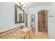 Bathroom with granite countertops, tiled shower, and neutral walls at 10127 Bluffmont Ln, Lone Tree, CO 80124