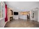 Open-concept living room boasts hardwood floors, a fireplace, and an abundance of natural light at 10127 Bluffmont Ln, Lone Tree, CO 80124
