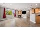Comfortable living room with hardwood floors, a fireplace, and an open layout at 10127 Bluffmont Ln, Lone Tree, CO 80124