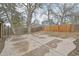 Concrete patio in backyard with a wooden fence at 2026 S Pitkin St, Aurora, CO 80013