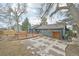 Backyard featuring a deck, patio, storage shed and well maintained landscaping at 2026 S Pitkin St, Aurora, CO 80013