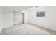 Carpeted bedroom offers closet space and natural light from the window at 2026 S Pitkin St, Aurora, CO 80013