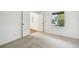Neutral carpeted bedroom with a window and open doorway, ready for personalization at 2026 S Pitkin St, Aurora, CO 80013