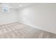 Carpeted bedroom with a window, fresh paint, and a baseboard trim at 2026 S Pitkin St, Aurora, CO 80013