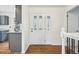Bright foyer with hardwood floors, decorative glass front door, and staircase at 2026 S Pitkin St, Aurora, CO 80013