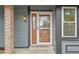 View of the home's front door with decorative glass and light fixture at 2026 S Pitkin St, Aurora, CO 80013