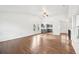 Spacious living area with hardwood floors and views of the kitchen and front door at 2026 S Pitkin St, Aurora, CO 80013