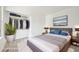 Comfortable bedroom featuring a plush bed, soft carpet, and ample closet space at 2026 S Pitkin St, Aurora, CO 80013