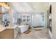 Luxurious bathroom with a soaking tub, glass shower, and modern fixtures at 17870 New London Rd, Monument, CO 80132