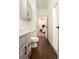 Clean bathroom features modern vanity, toilet, and shower, leading to a bedroom view at 17870 New London Rd, Monument, CO 80132