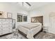 Cozy bedroom with neutral decor, wood accents, and a large window offering natural light at 17870 New London Rd, Monument, CO 80132