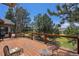 Inviting deck with wooded views, outdoor seating, and plenty of room for entertaining at 17870 New London Rd, Monument, CO 80132